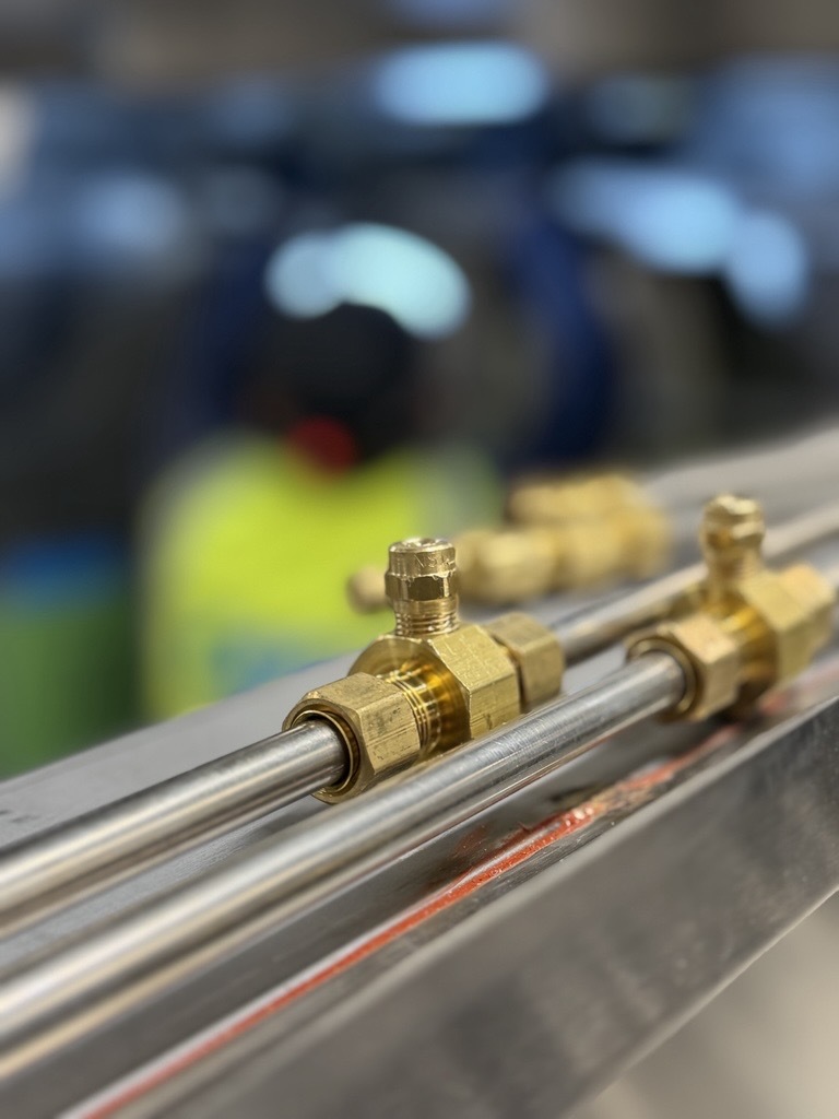 Close-up of Hood I.Q. brass misting nozzles